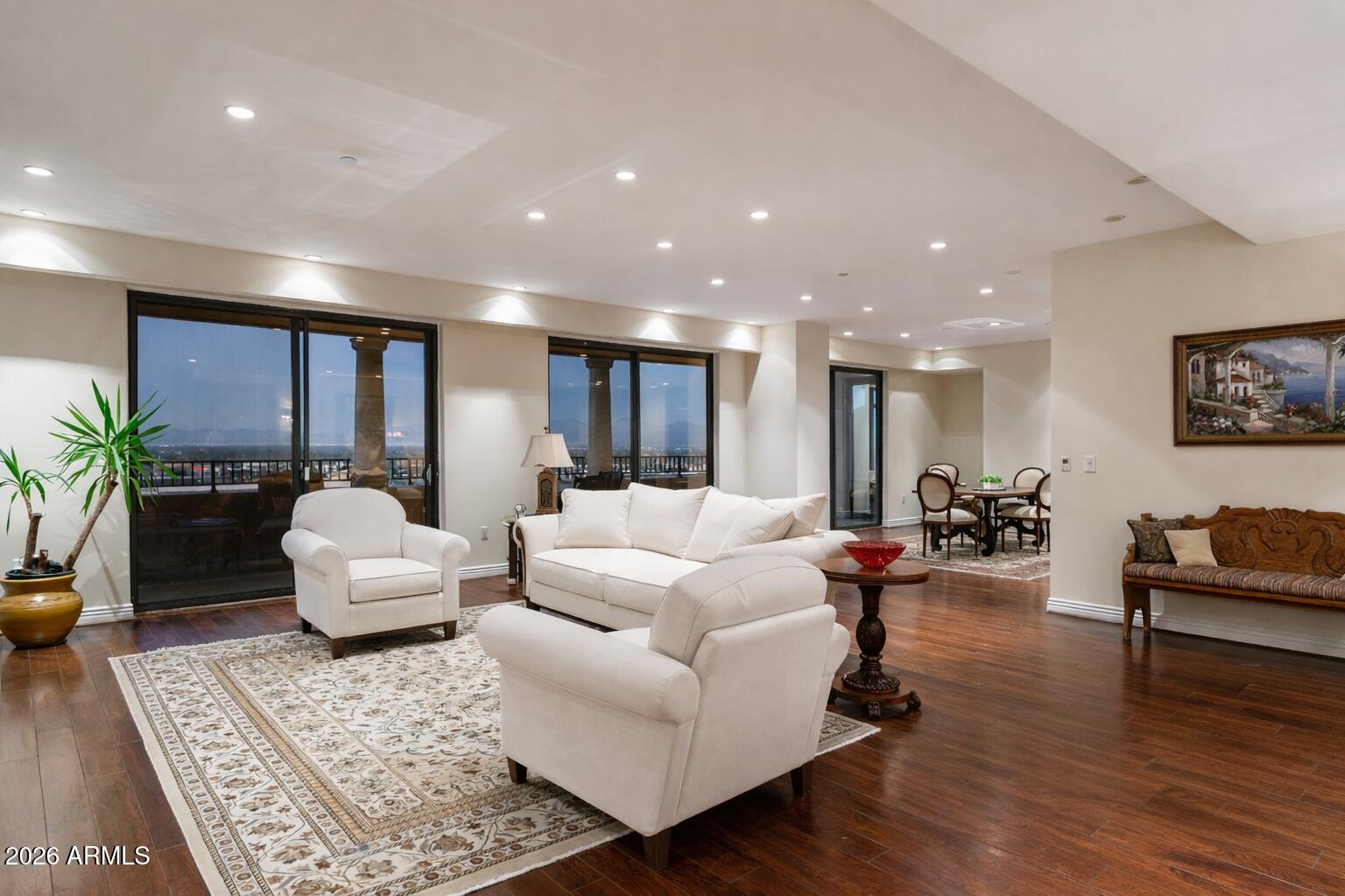 7181 East Camelback Road, Unit 1202 Scottsdale, AZ 85251 - Photo 7 of 47 a living room with furniture or wooden floor and a potted plant
