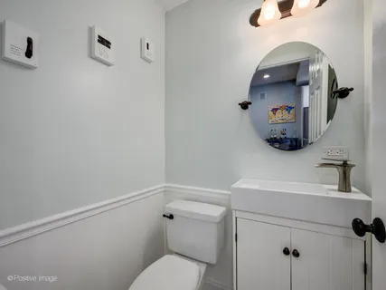 a bathroom with a toilet and a sink