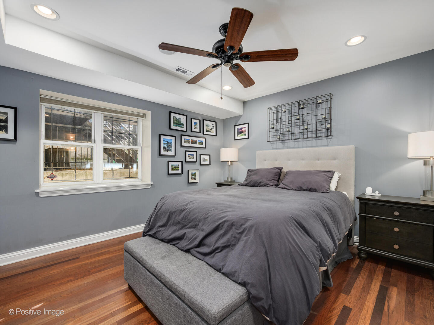 1440 North Wood Street, Unit 1R Chicago, IL 60622 - Photo 15 of 22 a spacious bedroom with a bed and wooden floor