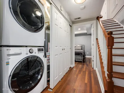 a view of a hallway with washer and dryer