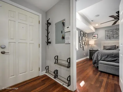 a view of a livingroom with furniture and hardwood floor