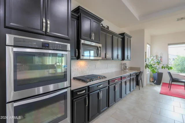 a dining room with furniture window and wooden floor