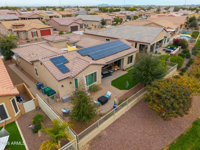 an aerial view of residential houses with outdoor space