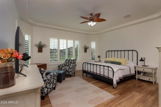 a bedroom with two beds and a couch