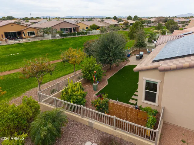 an aerial view of residential house with outdoor space and trees
