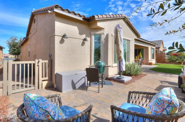 a front view of a house with a yard and a garage