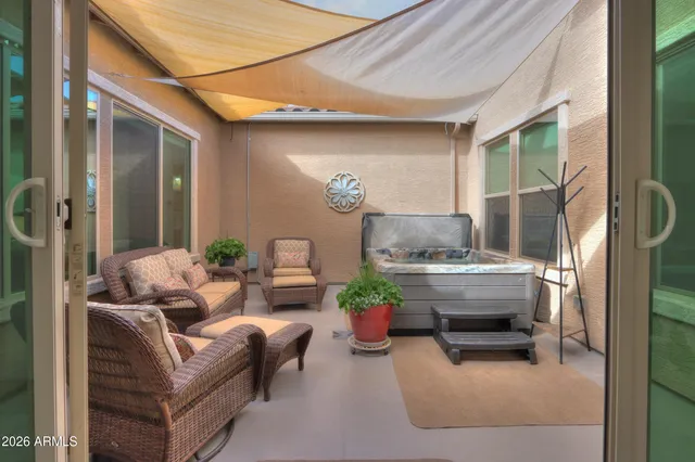 a kitchen with stainless steel appliances kitchen island granite countertop a refrigerator and a dining table