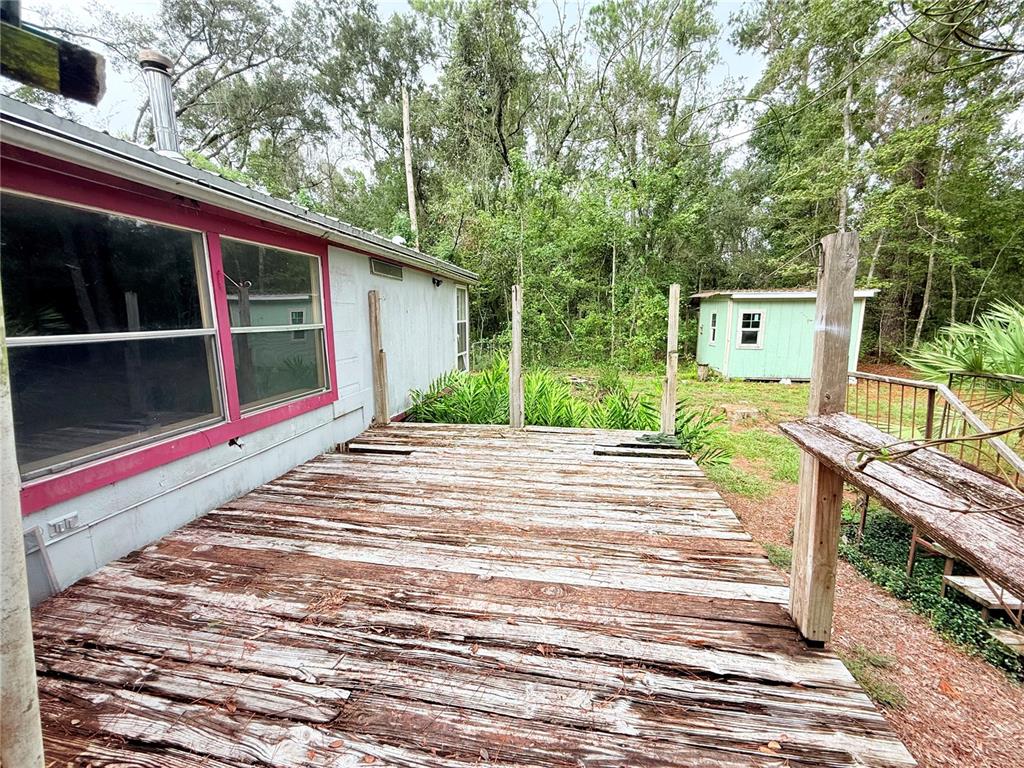 7324 Northwest 152nd Place Alachua, FL 32615 - Photo 31 of 44 a view of a backyard with a large tree