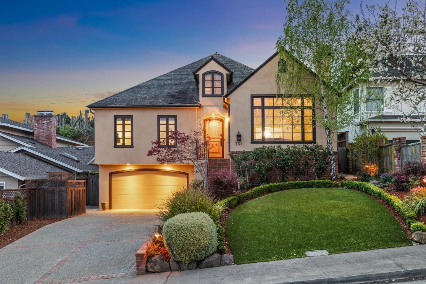 a front view of a house with a yard