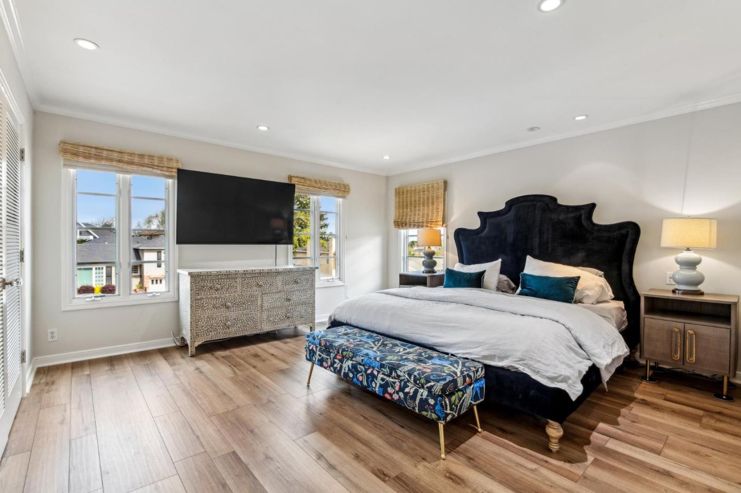 731 Oregon Avenue San Mateo, CA 94402 - Photo 14 of 34 a bedroom with a bed and a flat screen tv