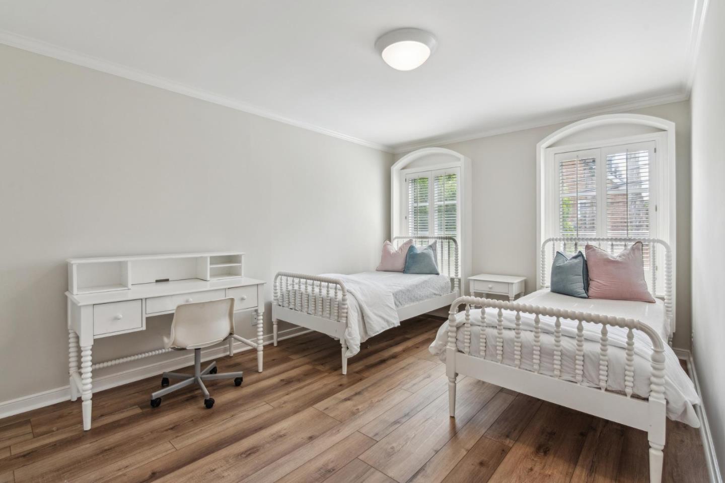 731 Oregon Avenue San Mateo, CA 94402 - Photo 17 of 34 a bedroom with a bed and wooden floor