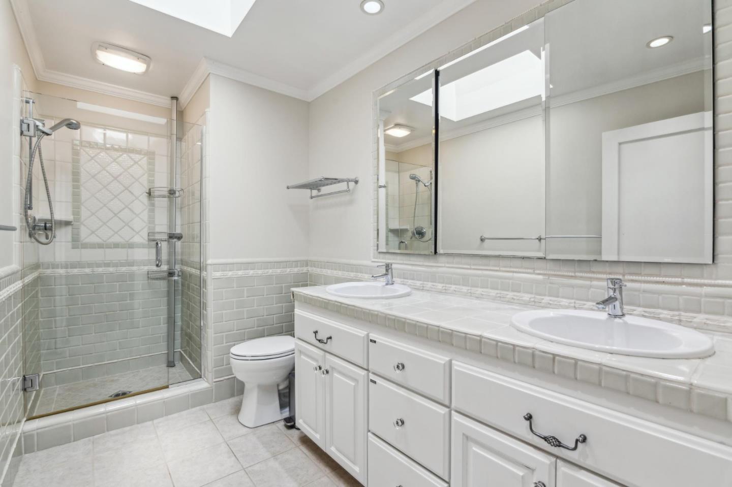 731 Oregon Avenue San Mateo, CA 94402 - Photo 18 of 34 a bathroom with a shower sink mirror and toilet
