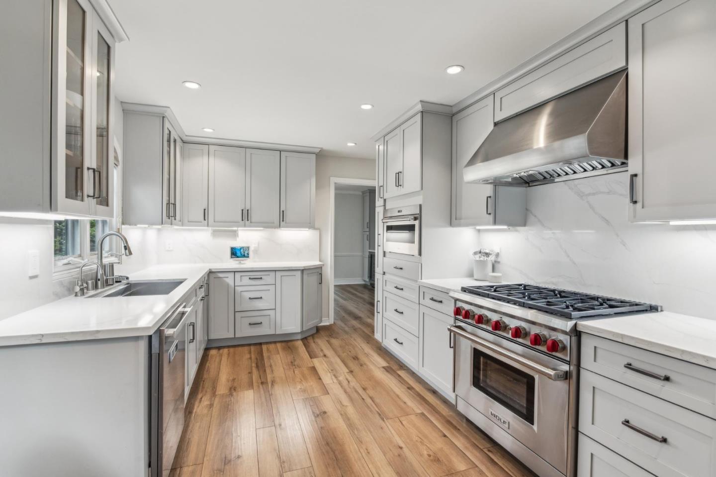 731 Oregon Avenue San Mateo, CA 94402 - Photo 5 of 34 a kitchen with granite countertop a sink stove and cabinets