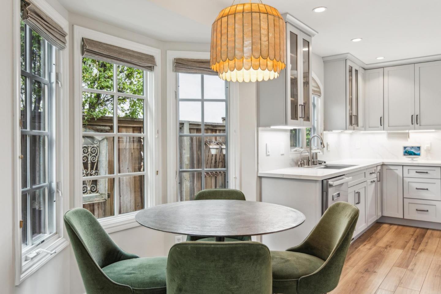 731 Oregon Avenue San Mateo, CA 94402 - Photo 7 of 34 a view of a dining room with furniture a chandelier and wooden floor