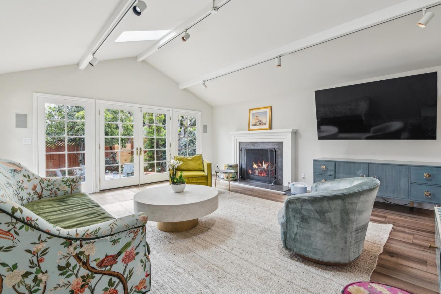 731 Oregon Avenue San Mateo, CA 94402 - Photo 10 of 34 a living room with furniture a flat screen tv and a fireplace