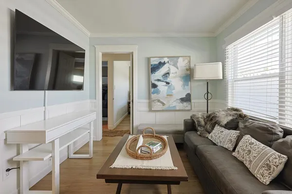 a living room with furniture and a table