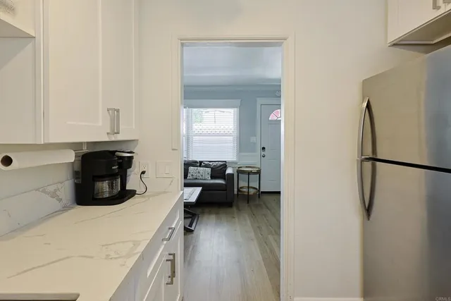 a outdoor living space with furniture potted plant and a rug