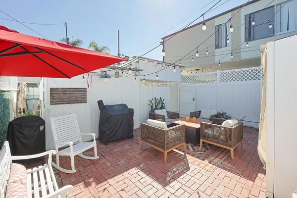 a dining room with furniture and wooden floor