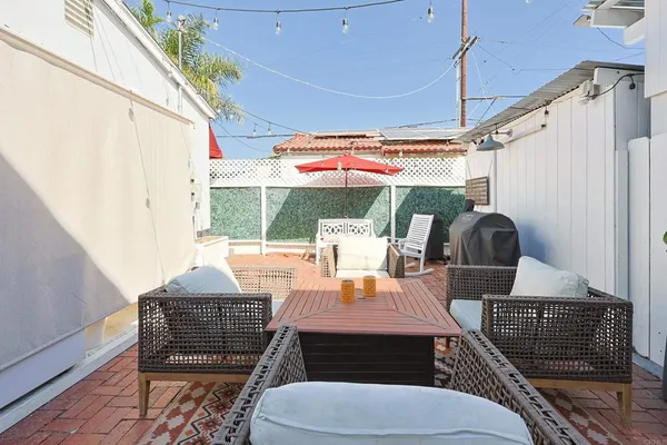 a outdoor dining space with furniture