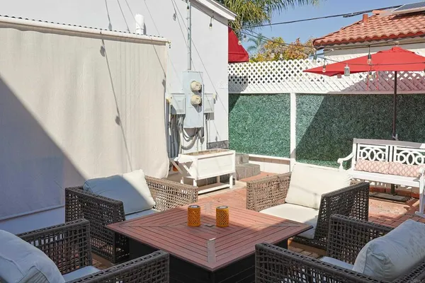 an outdoor space with patio furniture