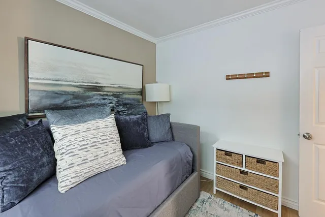 a view of room with window and wooden floor