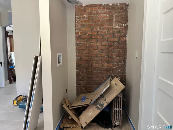 a kitchen with cabinets appliances a sink and a window