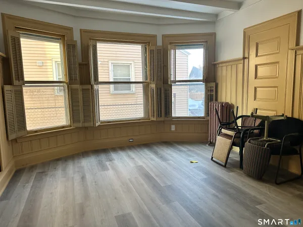 a living room with furniture and windows