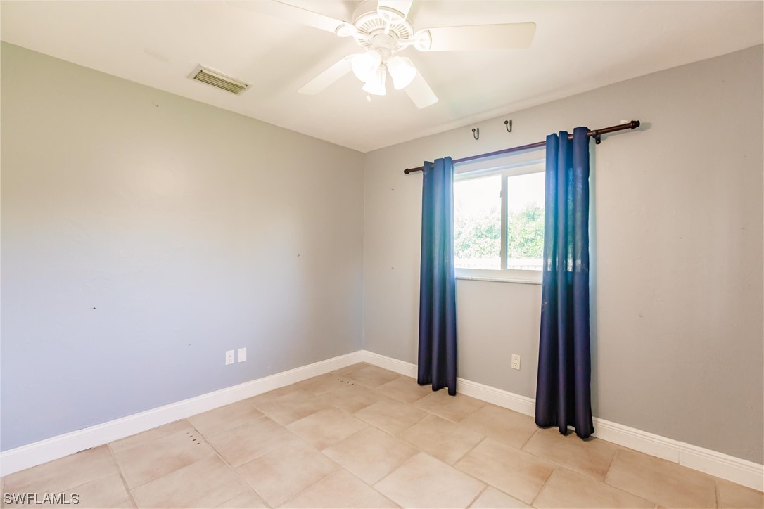 72 Pebble Beach Boulevard Naples, FL 34113 - Photo 12 of 15 a view of an empty room and window