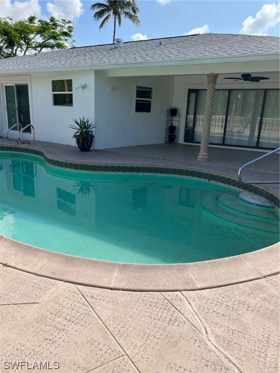 72 Pebble Beach Boulevard Naples, FL 34113 - Photo 2 of 15 a house view with a garden space