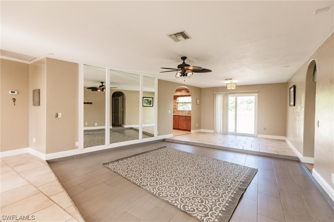 72 Pebble Beach Boulevard Naples, FL 34113 - Photo 4 of 15 a view of an empty room with a window