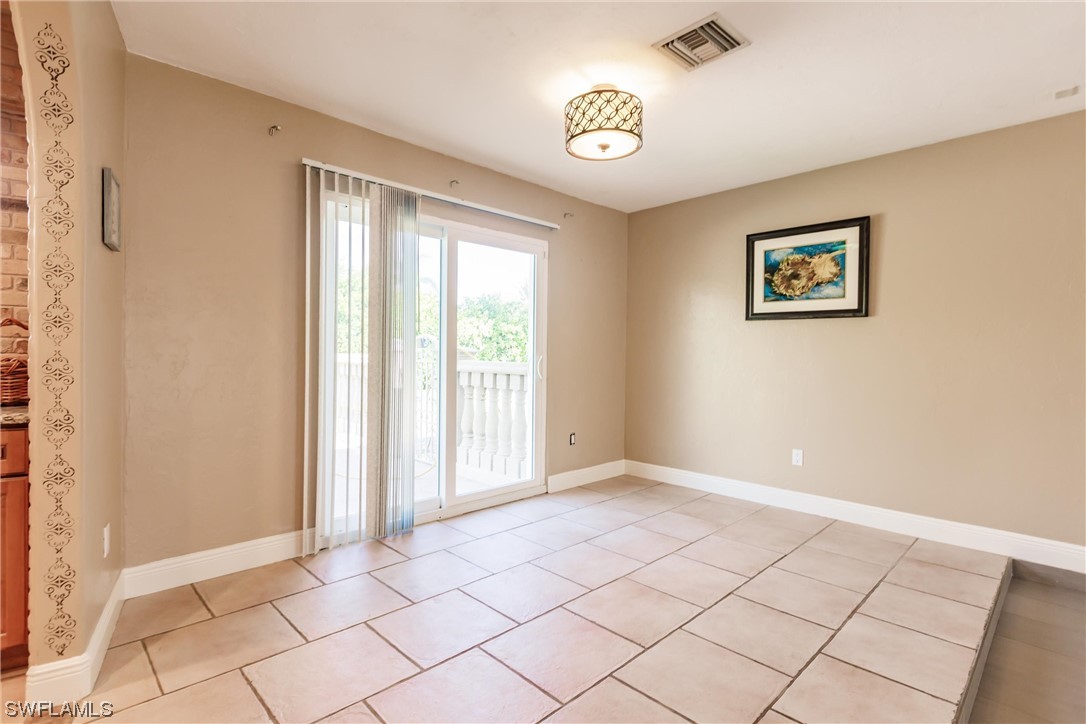 72 Pebble Beach Boulevard Naples, FL 34113 - Photo 6 of 15 a view of an empty room and window