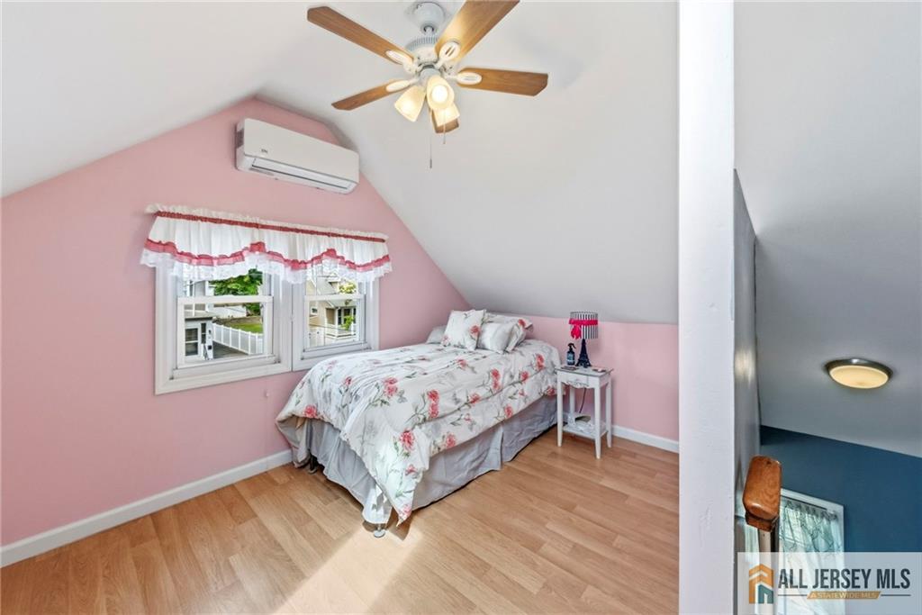 50 3rd Street Fords, NJ 08863 - Photo 20 of 36 a bedroom with a bed and a window