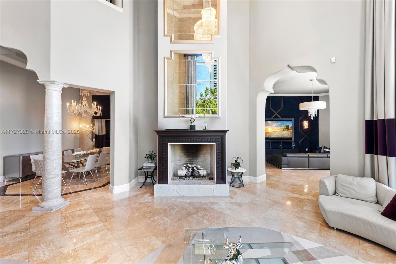 3914 Island Estates Drive Aventura, FL 33160 - Photo 12 of 40 a living room with furniture and a fireplace