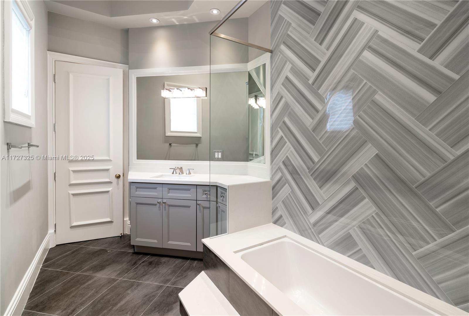 3914 Island Estates Drive Aventura, FL 33160 - Photo 20 of 40 a bathroom with a sink and a mirror