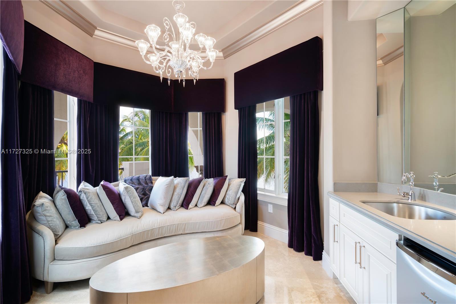 3914 Island Estates Drive Aventura, FL 33160 - Photo 22 of 40 a living room with furniture and a chandelier