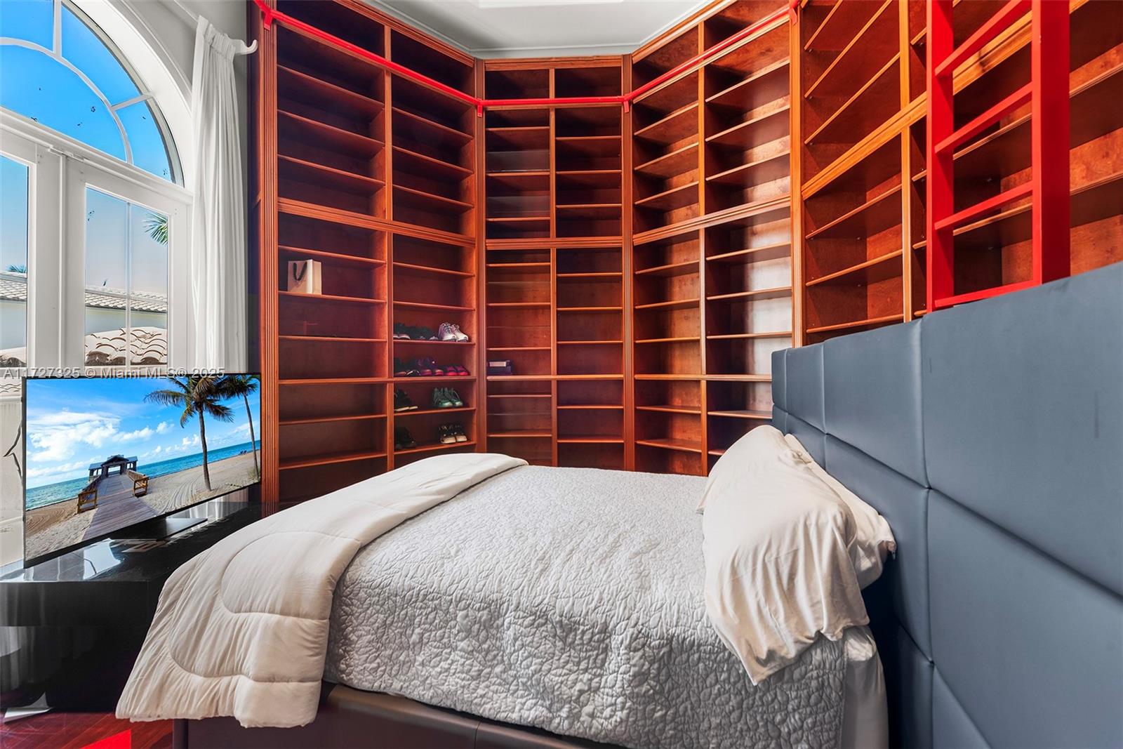 3914 Island Estates Drive Aventura, FL 33160 - Photo 24 of 40 a bedroom with a bed and a window