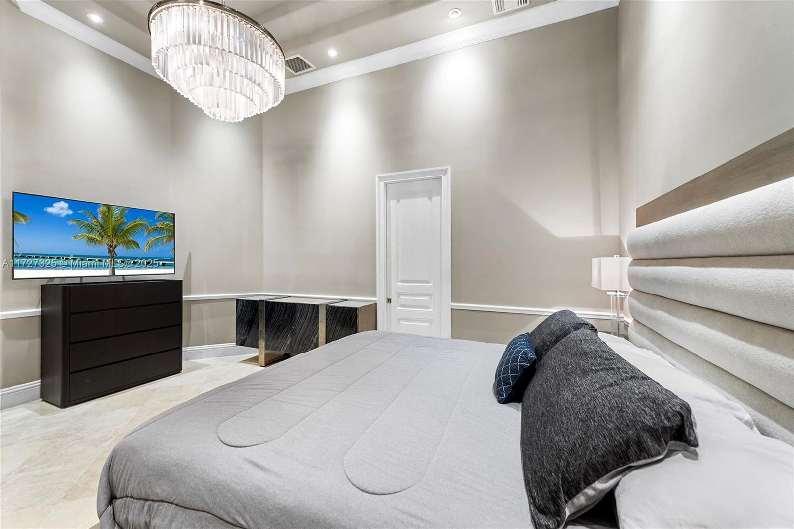 3914 Island Estates Drive Aventura, FL 33160 - Photo 27 of 40 a bedroom with a bed and dresser