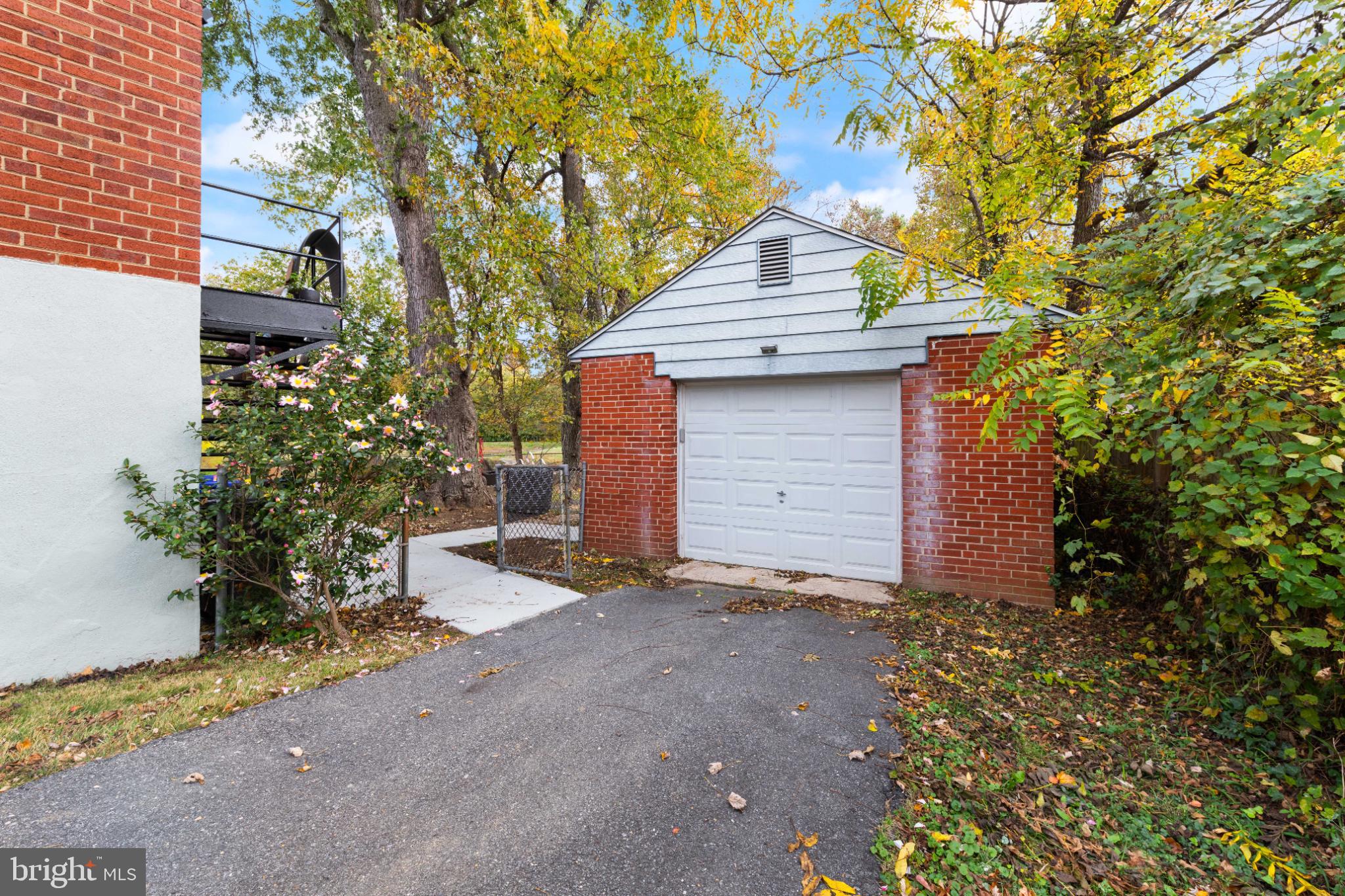 3700 Ralph Road Silver Spring, MD 20906 - Photo 28 of 30 Charming garage nestled among vibrant trees.