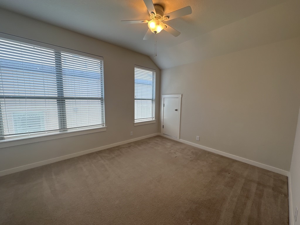 2101 Rivers Edge Way, Unit 32 Austin, TX 78741 - Photo 15 of 22 an empty room with a window and a fan