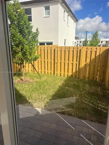 a view of a back yard of the house