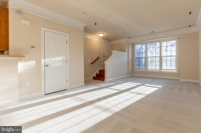 a view of a hallway with stairs