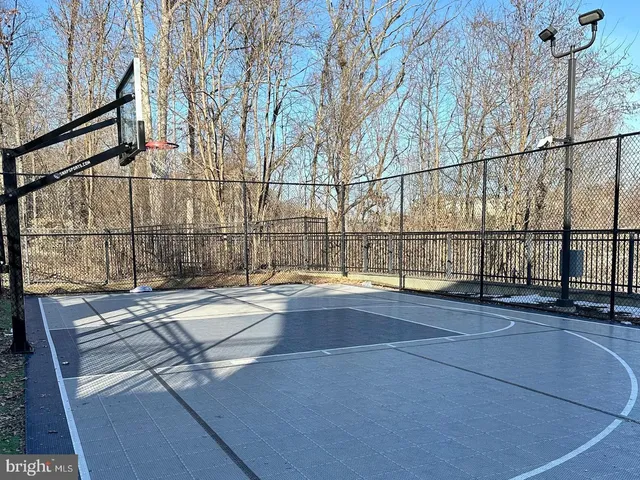 a front view of a house with a yard table and chairs