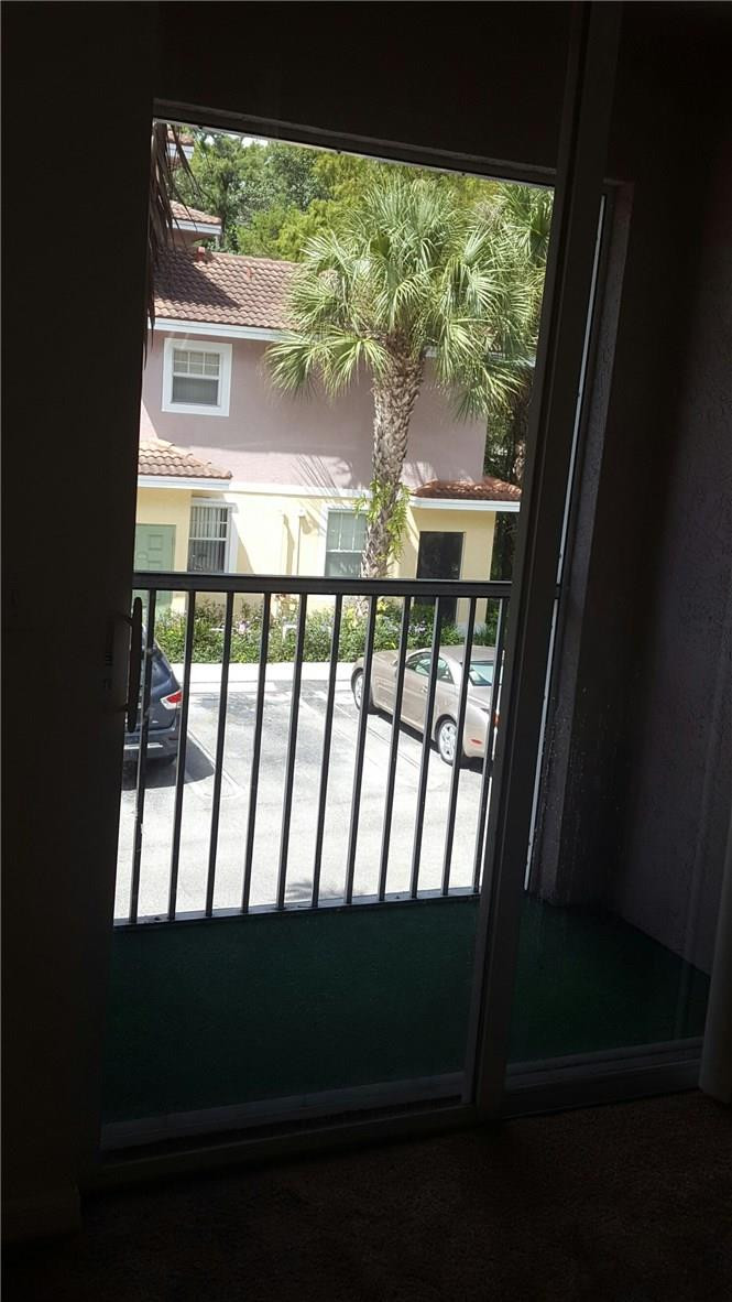 6720 West Sample Road, Unit 6720 Coral Springs, FL 33067 - Photo 7 of 8 a view of porch