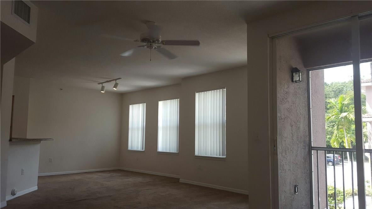 6720 West Sample Road, Unit 6720 Coral Springs, FL 33067 - Photo 8 of 8 a view of an empty room with a window