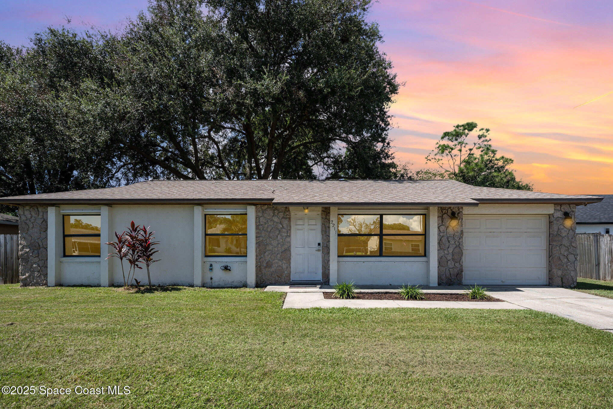 front view of a house with a yard