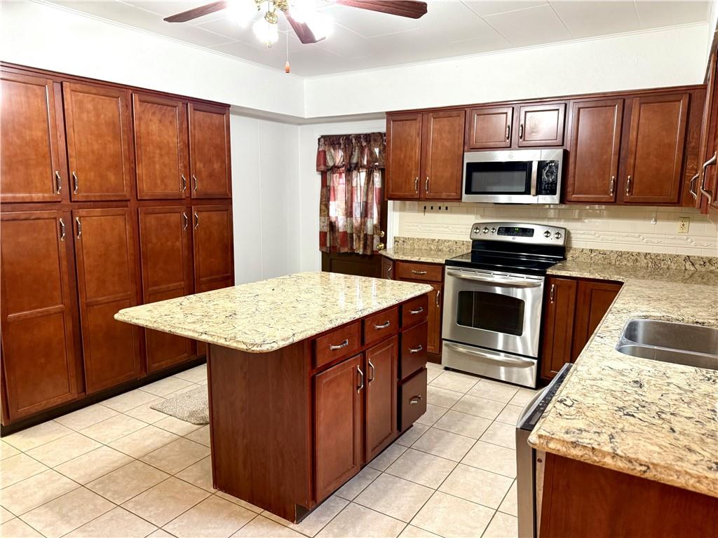 8 Spring Street Charleroi, PA 15022 - Photo 10 of 41 Spacious Eat-In-Kitchen with Granite Countertops, Island and Huge Pantry for Storage.
