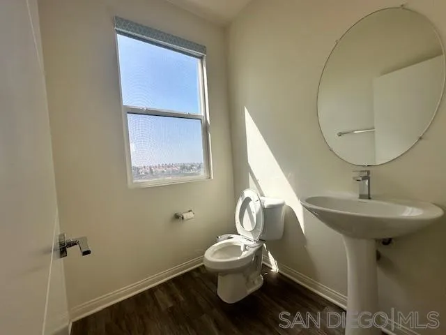 2036 Mayon Road Chula Vista, CA 91915 - Photo 14 of 49 a bathroom with a toilet sink and mirror