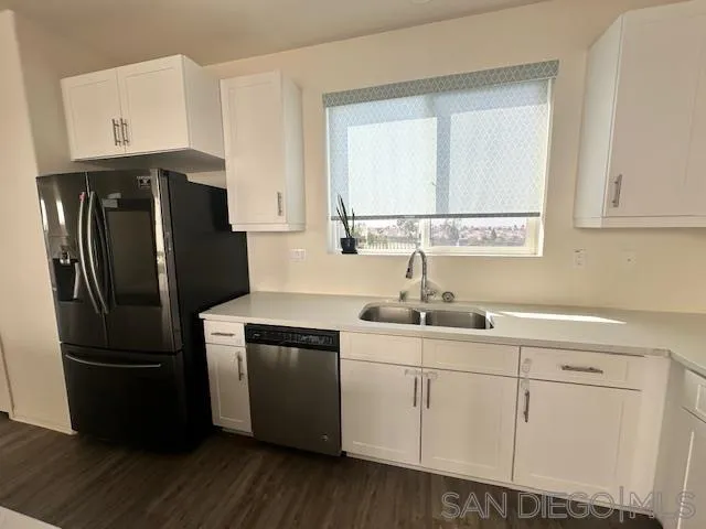 2036 Mayon Road Chula Vista, CA 91915 - Photo 19 of 49 a kitchen with appliances a sink and a window