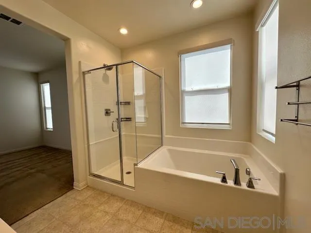 2036 Mayon Road Chula Vista, CA 91915 - Photo 31 of 49 a bathroom with a tub a shower and view