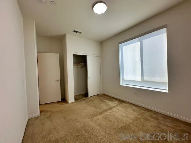 2036 Mayon Road Chula Vista, CA 91915 - Photo 34 of 49 an empty room with windows and closet